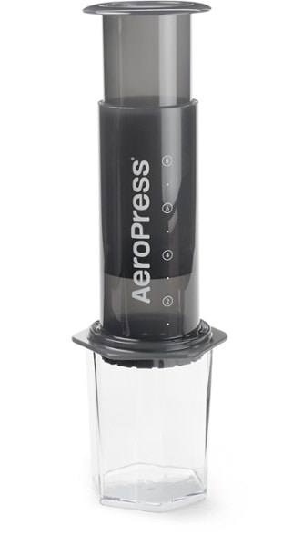 AeroPress XL coffee press in use during a camping trip, brewing espresso-style coffee