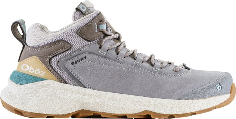 Side view of Oboz Cottonwood Mid B-DRY women's hiking boots on a rocky trail.