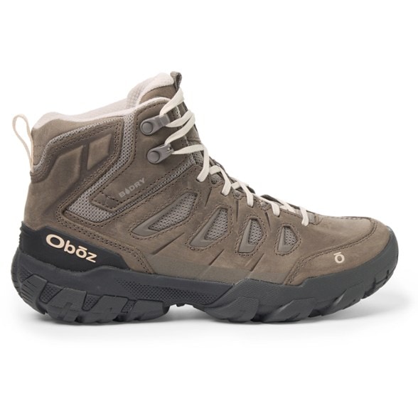 Side view of Oboz Women's Sawtooth X Mid Waterproof Hiking Boots on rocky terrain.
