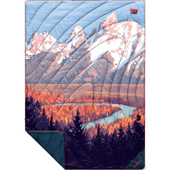 Eco-Friendly Puffy Blanket in use at a campsite, showcasing its warm and cozy design.