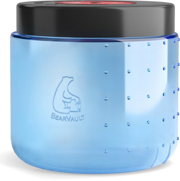 BearVault BV450 Jaunt lightweight bear proof food container on a campsite table, emphasizing its portability and design.