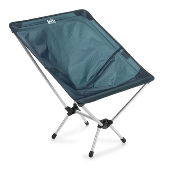 Flexlite Air Chair set up in the forest, showcasing its lightweight design.