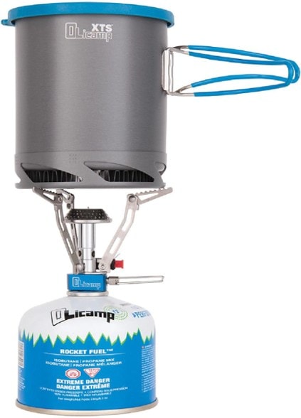 OliCamp Electron stove igniting with a flame in a natural setting.