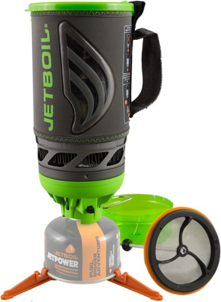 Jetboil Flash Java Camping Coffee Maker with coffee press and cooking cup in a scenic outdoor setting.