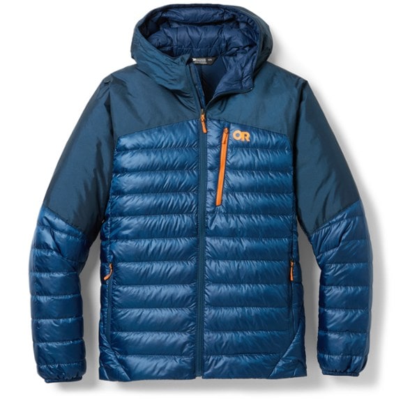 Men's Summit Shield Down Hoodie in action on a hiking trail, showcasing waterproof features.