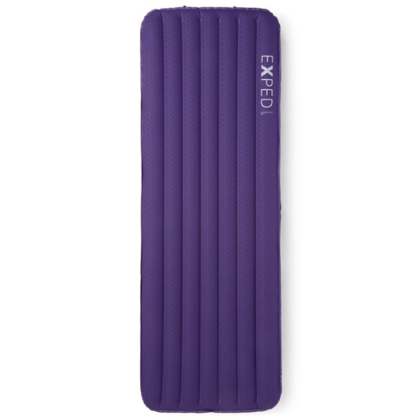 EcoComfort Ultra Sleeping Pad laid out in a camping setting, highlighting its thickness and comfort.