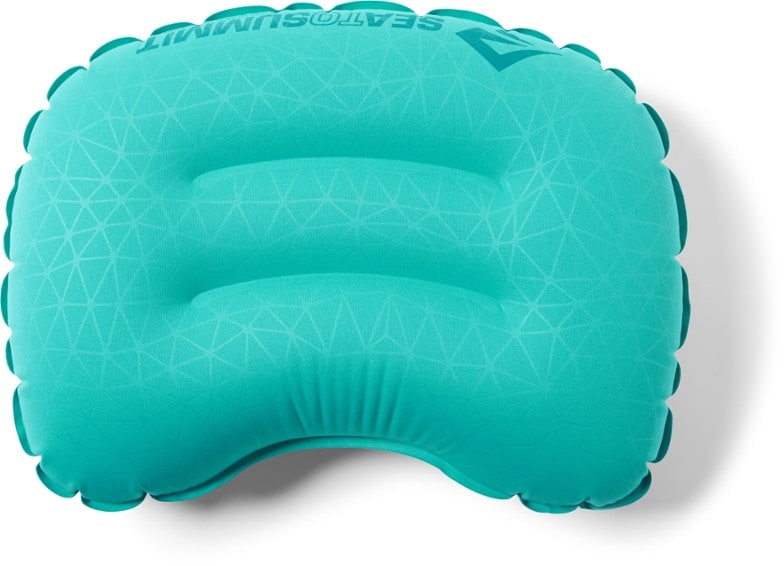 Sea to Summit Ultralight Pillow in use on a hiking trip, showcasing its compact design.