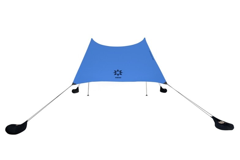 Overhead view of ShadeFlex sunshade set up at the beach, showing sand anchors in use